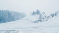 House on Mound in Winter Snowstorm Royalty Free Stock Photo