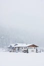 House in mountains, the snowfall