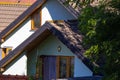 House with new brown metal tile roof and rain gutter. Metallic Guttering System, Guttering and Drainage Pipe Exterior Royalty Free Stock Photo