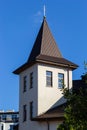 House with new brown metal tile roof and rain gutter. Metallic Guttering System, Guttering and Drainage Pipe Exterior Royalty Free Stock Photo