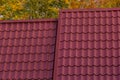 House with new brown metal tile roof and rain gutter. Metallic Guttering System, Guttering and Drainage Pipe Exterior Royalty Free Stock Photo