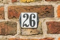 House number 26 black on white Royalty Free Stock Photo