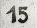 15 - house number fifteen on wall Royalty Free Stock Photo