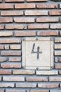 House Number 4 on Flat brick Wall