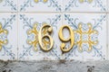 House number 69 in floral tiles in azulejo tiles Royalty Free Stock Photo