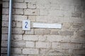 House number plate on a brick wall. Royalty Free Stock Photo