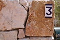 House number sign number three on a wall Royalty Free Stock Photo