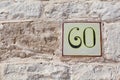 House number sixty as a square tile Royalty Free Stock Photo