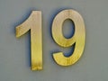 House Number 19 on Stucco Wall