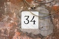 House number 34 engraved in stone Royalty Free Stock Photo