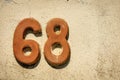 House Number 68 on the wall in Liguria Italy Royalty Free Stock Photo