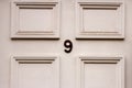 House number 9 on a white door