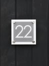 House number 22 on wooden wall happy new home moving away modern door number twenty two