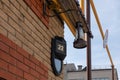 House number 22 written in white on a modern plastic plaque on brick wall Royalty Free Stock Photo