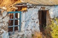 House old ruined abandoned askew one, storey with broken glass in window, collapsed roof