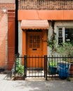 House with orange door in Greenpoint, Brooklyn, New York City Royalty Free Stock Photo