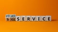 In-house or outsourced service symbol. Turned wooden cubes and changed words In-house service to Outsourced service. Orange