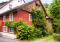 House overgrown by ivy, home design with plants and flowers Royalty Free Stock Photo