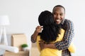 House Owners. Happy African American Man Holding Home Keys And Embracing Wife Royalty Free Stock Photo