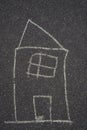 A house painted by a child in chalk. A painted house is a symbol of a family buying or renting a house, vertical image