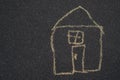 A house painted by a child in chalk. A painted house is a symbol of a family buying or renting a house, horisontal image