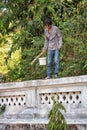 The house painter paints a fence