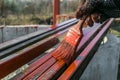 House painter paints metal structures. Protective coating of steel closed profiles with primer iron oxide red Royalty Free Stock Photo