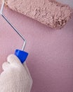 House painter using paint roller, painting wall Royalty Free Stock Photo