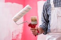 House painter worker with work tools. Construction site Royalty Free Stock Photo