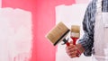 House painter worker with work tools. Construction site Royalty Free Stock Photo