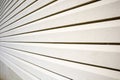 House with pale yellow vinyl siding