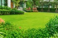 House in the park, Green lawn, front yard is beautifully designed garden, Flowers in the garden, Green grass, Modern house with be Royalty Free Stock Photo