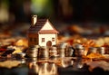 house perched on a stack of coins, symbolizing the financial concept of investment, savings, and real estate.