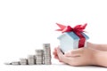 House piggy bank in little hand Royalty Free Stock Photo