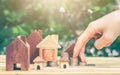 House placed on coins Men`s hand is planning savings money of coins to buy a home Royalty Free Stock Photo