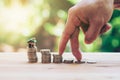 House placed on coins Men`s hand is planning savings money of coins to buy a home Royalty Free Stock Photo