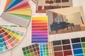 House plans project and color catalog samples on office desk