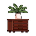 House plant in ceramic pot over drawer