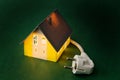 A house with power plug Royalty Free Stock Photo