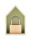 House protection concept. Small wooden house with metal padlock