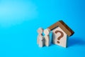 House with a question mark and family. Search for affordable housing. Social programs, preferential mortgage loans, government Royalty Free Stock Photo