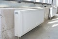 House radiator heating. Installing radiator heating at home. White metal radiators heating