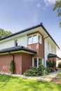 House with red brick wall with green grass Royalty Free Stock Photo