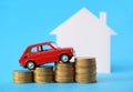 House, red miniature car and money Royalty Free Stock Photo