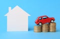 House, red miniature car and money Royalty Free Stock Photo