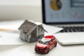 House, red miniature car and money Royalty Free Stock Photo