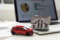 House, red miniature car and money Royalty Free Stock Photo