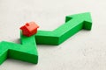 House and red up arrow. Rising real estate prices. Raising insurance or tax rates Royalty Free Stock Photo
