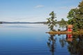 House reflected in scenic lake