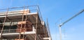 House for renovation with the scaffolding for bricklayers Royalty Free Stock Photo